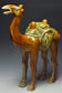 A LARGE TANG DYNASTY SANCAI-GLAZED POTTERY CAMEL