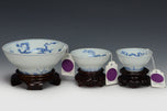 THREE DRAGON CUPS YONGZHENG MARK AND PERIOD AND STAND EX. SOTHEBY'S