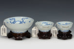 THREE DRAGON CUPS YONGZHENG MARK AND PERIOD AND STAND EX. SOTHEBY'S