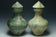 TWO LARGE HAN DYNASTY GREEN GLAZED HU VASES AND COVERS