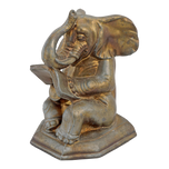 SINGLE VINTAGE ELEPHANT READING BOOK BOOKEND, MID 20TH CENTURY, UNITED STATES, METAL