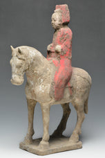 A CHINESE TANG DYNASTY PAINTED POTTERY HORSE AND RIDER