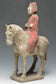 A CHINESE TANG DYNASTY PAINTED POTTERY HORSE AND RIDER