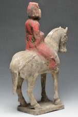 A CHINESE TANG DYNASTY PAINTED POTTERY HORSE AND RIDER