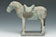 A CHINESE MING DYNASTY PAINTED POTTERY HORSE