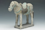 A CHINESE MING DYNASTY PAINTED POTTERY HORSE