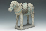A CHINESE MING DYNASTY PAINTED POTTERY HORSE