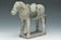 A CHINESE MING DYNASTY PAINTED POTTERY HORSE