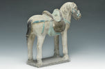 A CHINESE MING DYNASTY PAINTED POTTERY HORSE