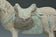A CHINESE MING DYNASTY PAINTED POTTERY HORSE