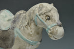 A CHINESE MING DYNASTY PAINTED POTTERY HORSE