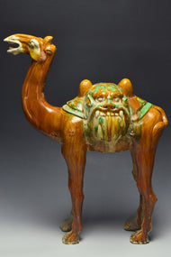 A LARGE TANG DYNASTY SANCAI-GLAZED POTTERY CAMEL