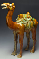 A LARGE TANG DYNASTY SANCAI-GLAZED POTTERY CAMEL
