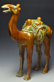 A LARGE TANG DYNASTY SANCAI-GLAZED POTTERY CAMEL
