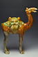 A LARGE TANG DYNASTY SANCAI-GLAZED POTTERY CAMEL