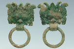 A PAIR OF HAN DYNASTY GILT BRONZE MASK RING HANDLES