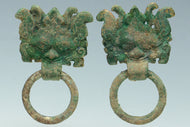 A PAIR OF HAN DYNASTY GILT BRONZE MASK RING HANDLES
