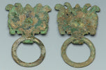 A PAIR OF HAN DYNASTY GILT BRONZE MASK RING HANDLES