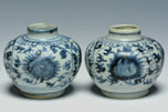 A PAIR OF EARLY MING DYNASTY BLUE AND WHITE JARS