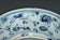 A MING DYNASTY BLUE AND WHITE FIGURAL DISH 16TH CENTURY