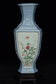 A LATE QING DYNASTY FAMILLE ROSE VASE QIANLONG MARK AND STAND