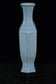 A LATE QING DYNASTY FAMILLE ROSE VASE QIANLONG MARK AND STAND
