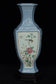 A LATE QING DYNASTY FAMILLE ROSE VASE QIANLONG MARK AND STAND