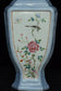 A LATE QING DYNASTY FAMILLE ROSE VASE QIANLONG MARK AND STAND