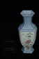 A LATE QING DYNASTY FAMILLE ROSE VASE QIANLONG MARK AND STAND