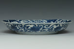 A MING DYNASTY BLUE AND WHITE DRAGON DISH WANLI MARK AND PERIOD AND BOX