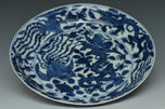 A MING DYNASTY BLUE AND WHITE DRAGON DISH WANLI MARK AND PERIOD AND BOX