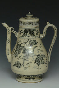 AN EARLY MING DYNASTY BLUE AND WHITE WINE EWER EX. CHRISTIE'S 2009