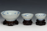 THREE DRAGON CUPS YONGZHENG MARK AND PERIOD AND STAND EX. SOTHEBY'S