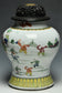 A QING DYNASTY FAMILLE ROSE BOYS JAR WITH WOODEN COVER YONGZHENG PERIOD