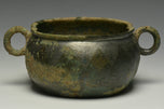 A HAN DYNASTY TWIN HANDLED BRONZE INCENCE BURNER