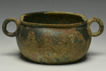 A HAN DYNASTY TWIN HANDLED BRONZE INCENCE BURNER