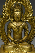A GILT-BRONZE FIGURE OF AMITAYUS QIANLONG MARK AND PERIOD
