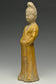 A TANG DYNASTY AMBER GLAZED FIGURE OF A COURT LADY