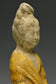 A TANG DYNASTY AMBER GLAZED FIGURE OF A COURT LADY