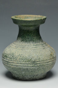 A HAN DYNASTY GREEN GLAZED HU SHAPED VASE