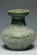 A HAN DYNASTY GREEN GLAZED HU SHAPED VASE