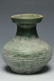A HAN DYNASTY GREEN GLAZED HU SHAPED VASE