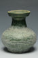 A HAN DYNASTY GREEN GLAZED HU SHAPED VASE