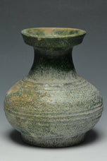A HAN DYNASTY GREEN GLAZED HU SHAPED VASE