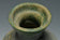 A HAN DYNASTY GREEN GLAZED HU SHAPED VASE