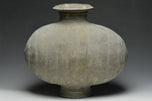 A LARGE HAN DYNASTY POTTERY COCOON JAR