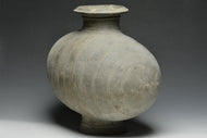 A LARGE HAN DYNASTY POTTERY COCOON JAR