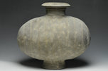 A LARGE HAN DYNASTY POTTERY COCOON JAR