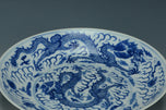 A BLUE AND WHITE DRAGON DISH KANGXI MARK 19TH CENTURY
