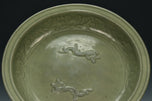 A LARGE YUAN DYNASTY LONGQUAN CELADON DRAGON DISH